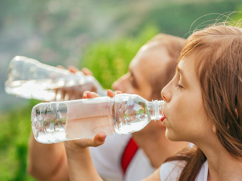 Father daughter drinking water