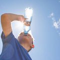 child drinking water during heatwave generic image