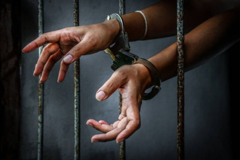 Woman in handcuffs