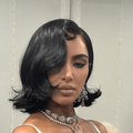 Kim Kardashian's short black hair styled in a retro look