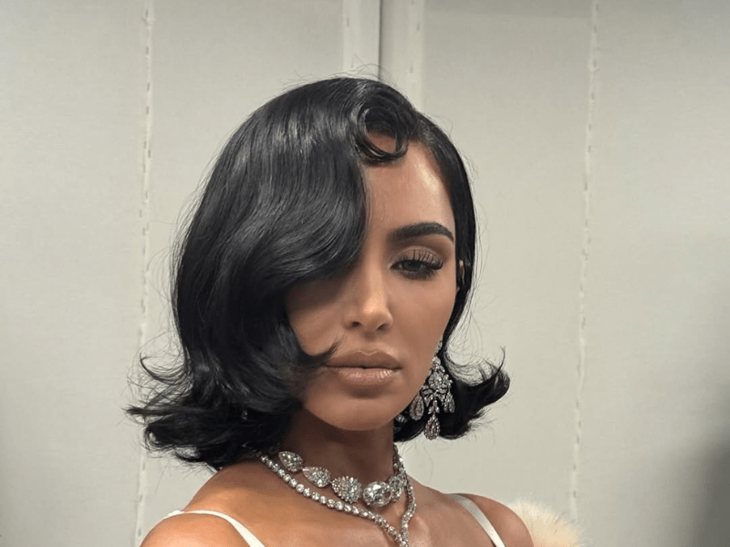 Kim Kardashian's short black hair styled in a retro look