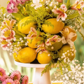 Table centrepiece decorated with lemons and baby's breath