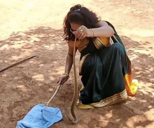 Woman rescues snake