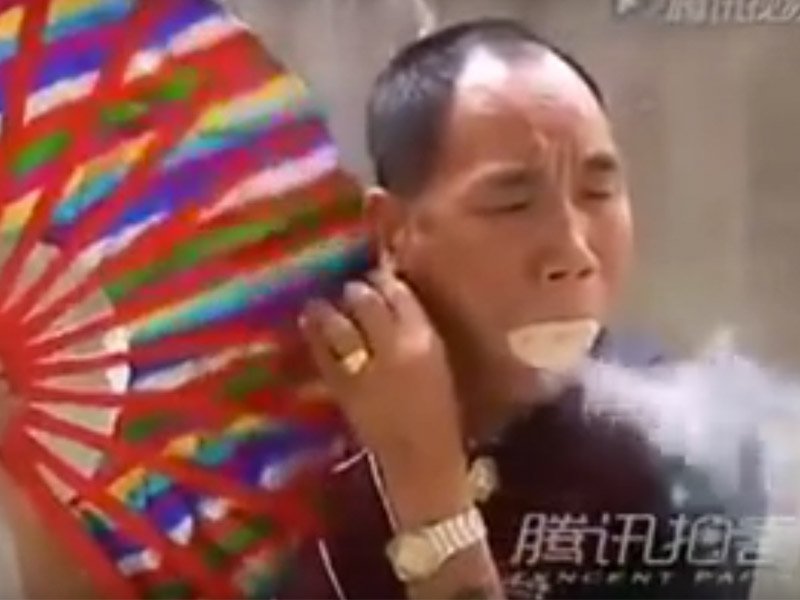 man breathes fire
