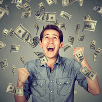 man celebrates as dollar bills fall around him