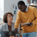 man and woman in an office setting