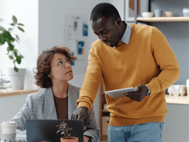man and woman in an office setting