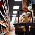 Close up of man with shopping basket buying groceries at the store
