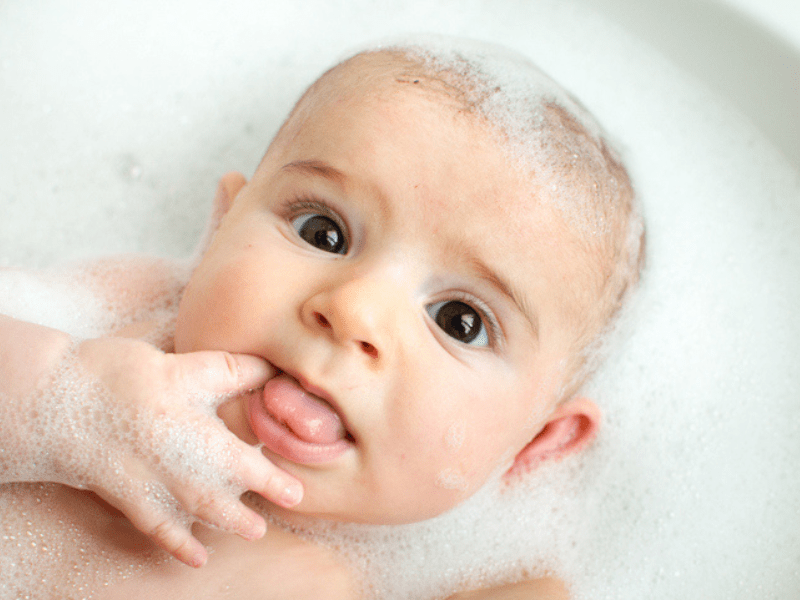 Newborn baby in a bubble bath