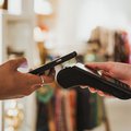 Person paying bill using phone
