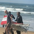 Durban Search and Rescue teams carry a piece of the plane wreckage