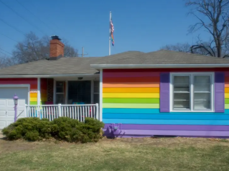 INSPIRING: A man paints his house in the PRIDE colours
