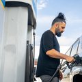 Person puts in fuel as international oil prices soar in October 2026