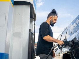 Person puts in fuel as international oil prices soar in October 2026
