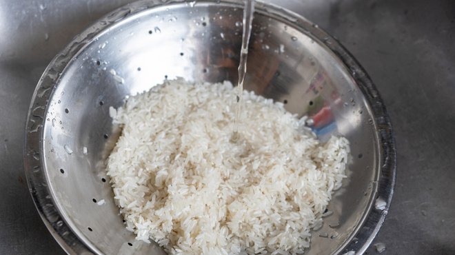 Washing rice in a bowl