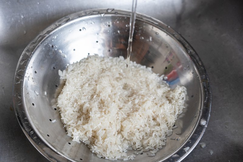 Washing rice in a bowl