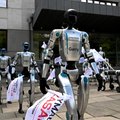 Humanoid and quadruped robots attend a demonstration calling for the regulation of artificial intelligence development