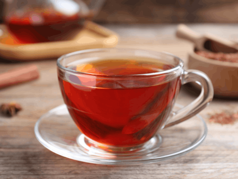 Rooibos tea in a transparent glass cup
