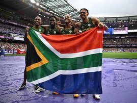 Silver medallists Bayanda Walaza, Shaun Maswanganyi, Bradley Nkoana and Akani Simbine of team South Africa celebrate at Paris 2024 Olympic Games