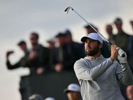 US golfer Scottie Scheffler watches his iron shot on the 16th tee