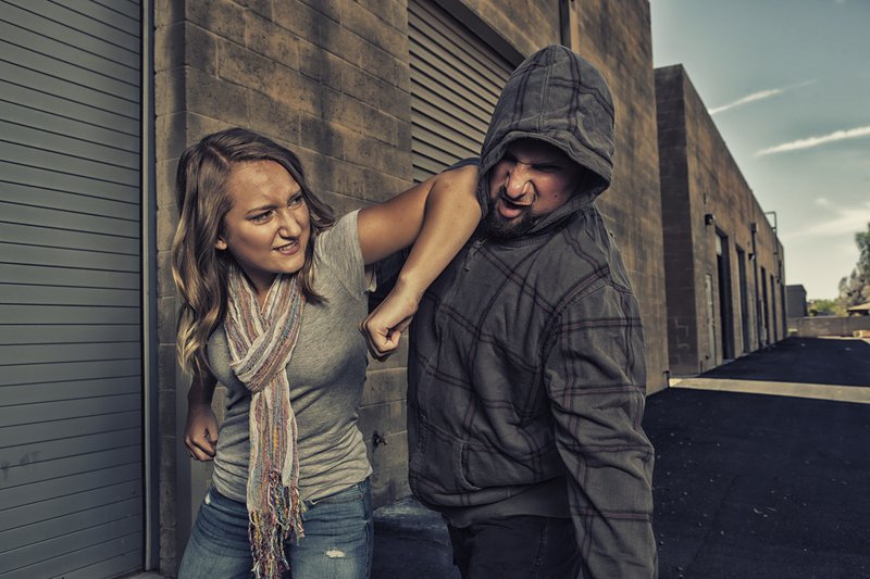 Woman fighting in self-defence