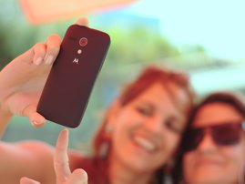 Man takes selfie in front of train
