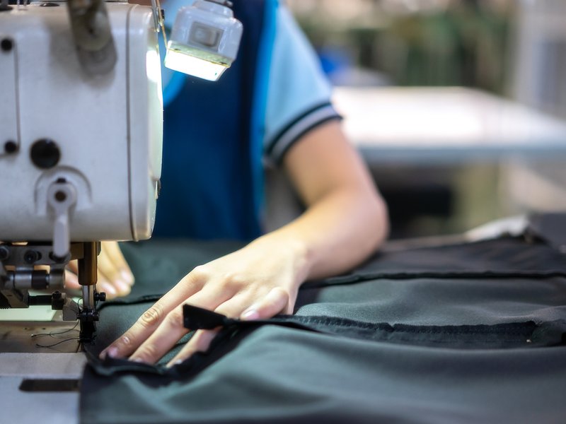 Tailor sewing clothes