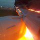 Fire engulfs Singapore Airlines plane's wing