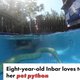 A girl swimming with snake