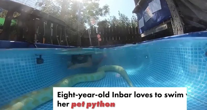 A girl swimming with snake