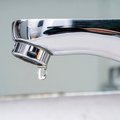 Drop of water falling from faucet
