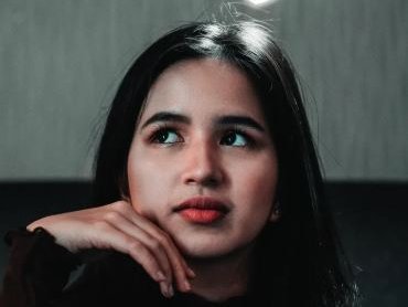A photo of woman looking upwards