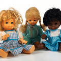 three dolls in a studio