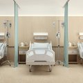 three empty hospital beds