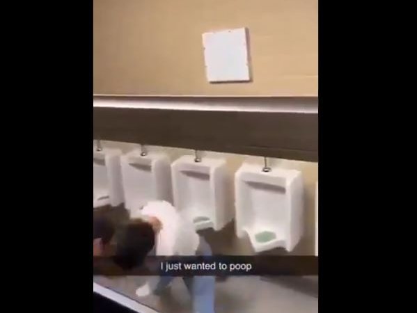 Two men fighting in the bathroom