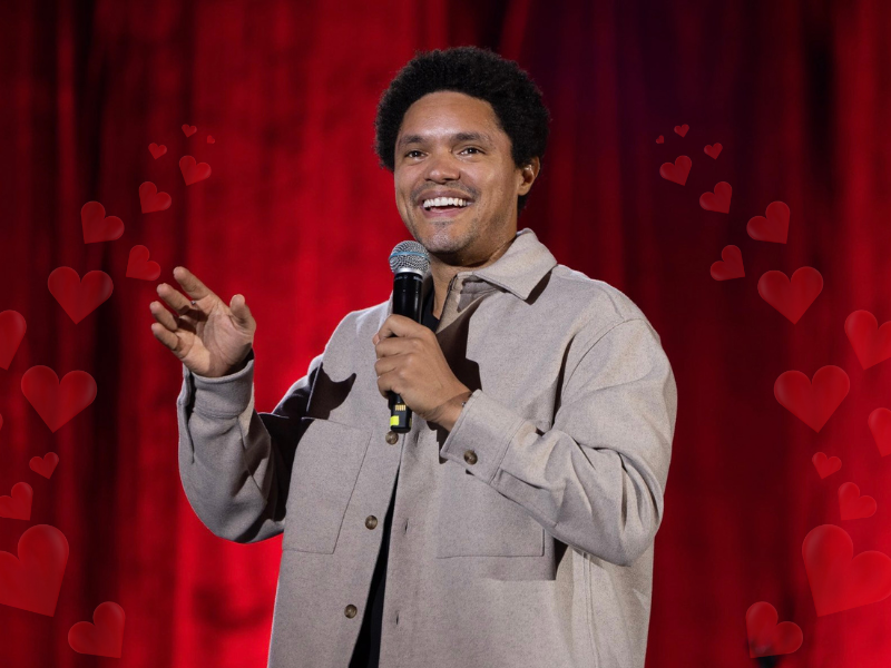 Trevor Noah with hearts around him on stage