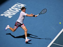 Greece's Stefanos Tsitsipas hits a return against Russia's Karen Khachanov