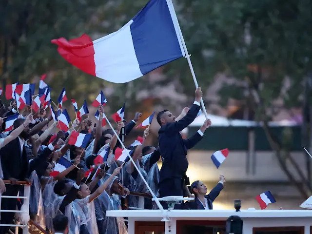 Olympic games Paris 2024 Opening Ceremony French Team with Florent Manaudou, swimming (London gold medalist in the 50-meter freestyle and three-time Olympic silver medalist) flag bearer