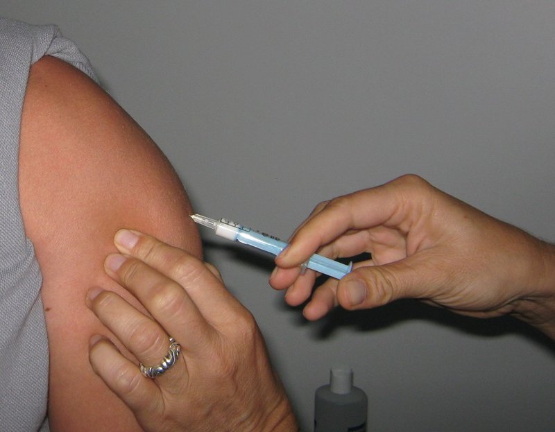 administering vaccine