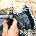 Man holding vape in hands