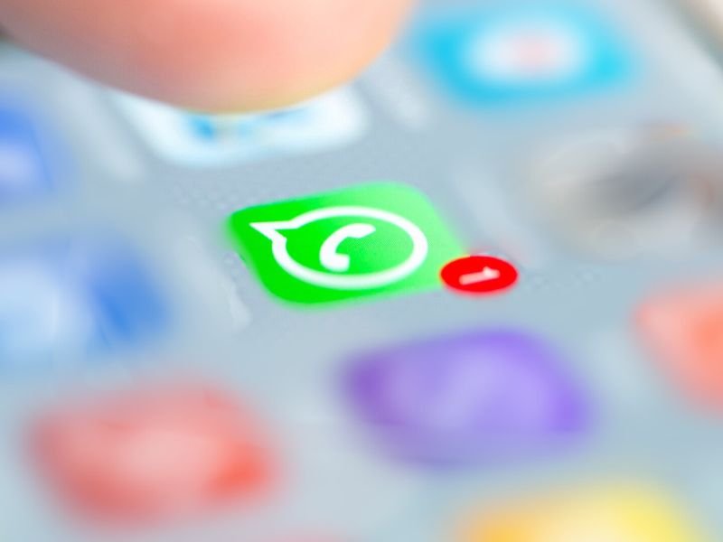 WhatsApp on phone with blurred background