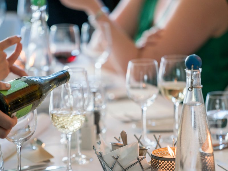 Pouring wine/ Pexels