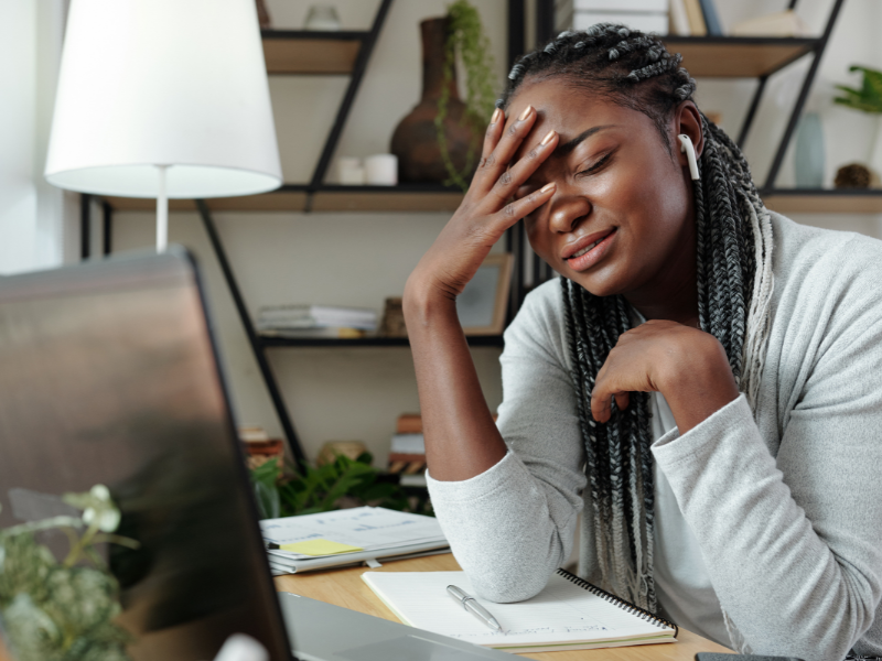 woman crying at work on laptop