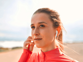 woman in sportswear listening to music