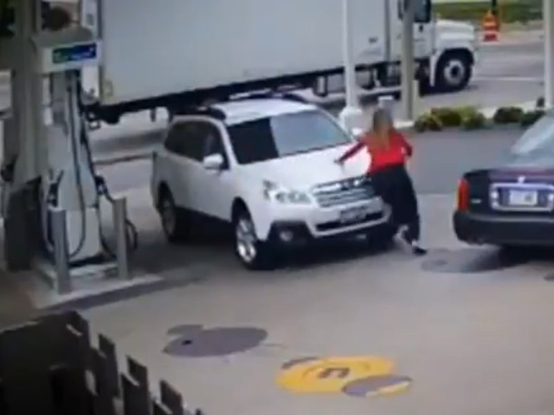 Woman jumps on car during hijacking
