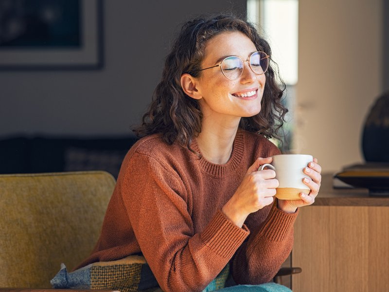Woman relaxing and drinking hot tea