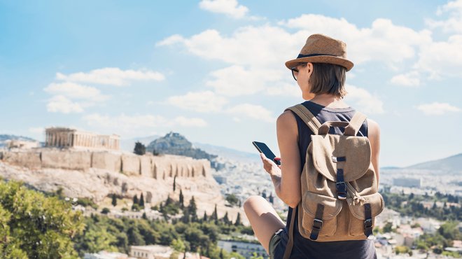 Woman using smart phone on vacation