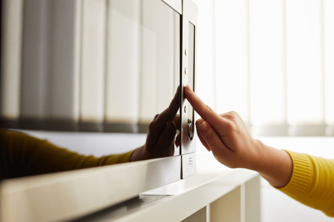 Woman using a microwave