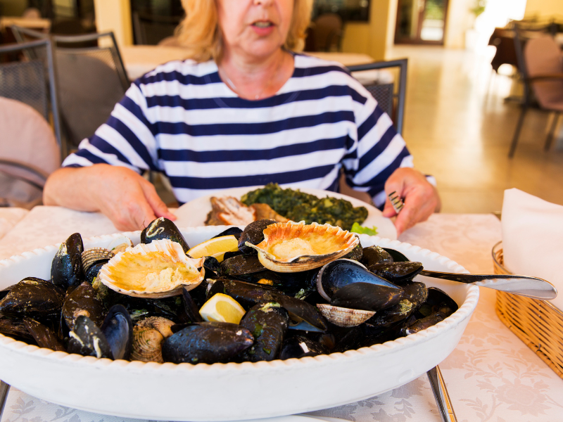 Woman at table with oysters