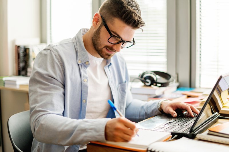 Young man studying at home